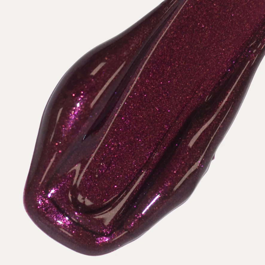 Lip colour serum shade Jam is a dark purple color.